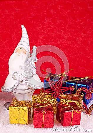 Santa ceramic figure on red background Stock Photo
