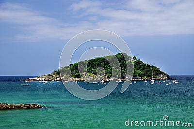 Santa Clara Island, is located in La Concha Bay in San Sebastian, Spain Stock Photo