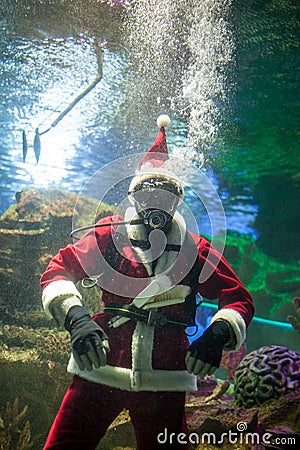 Santa Claus with aqualung under water Stock Photo