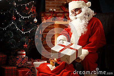 Santa Claus brought gifts for Christmas and having a rest Stock Photo