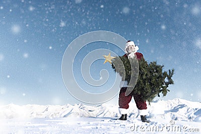 Santa Claus Carrying Christmas Tree on Snow Mountain Concept Stock Photo