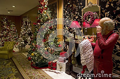 Santa Claus Christmas trees lights luxury hotel lobby Stock Photo