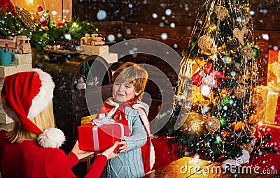 Santa claus coming. Mother and little child boy adorable friendly family having fun. Family having fun at home christmas Stock Photo