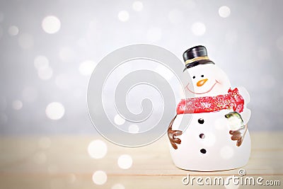 Santa Claus doll on wooden table and bright abstract background Stock Photo