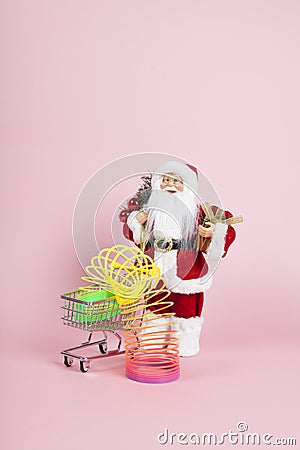 Santa Claus pink shopping trolley with rainbow Editorial Stock Photo