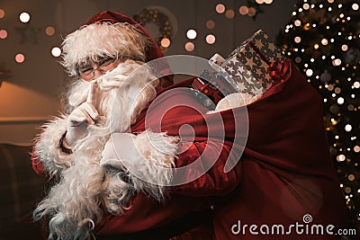 Santa Claus with finger on the lips Stock Photo