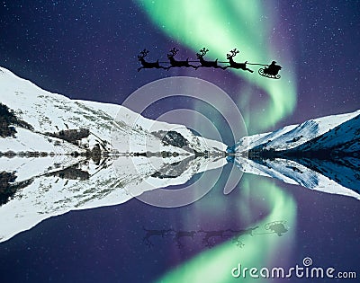 Santa Claus with flying reindeer Stock Photo