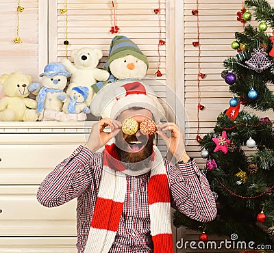 Santa Claus with funny face with tree decoration balls Stock Photo