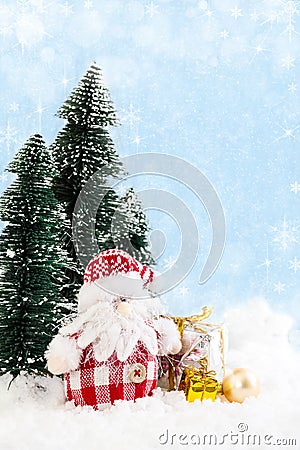 Santa Claus with gifts on snowy background Stock Photo