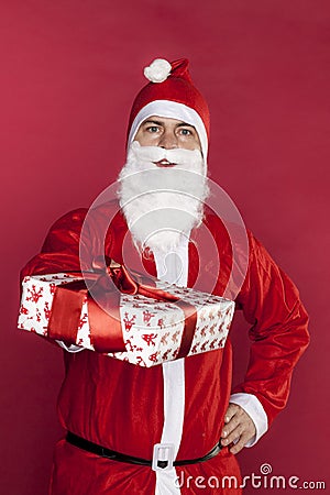 Santa Claus gives a gift specially for you Stock Photo