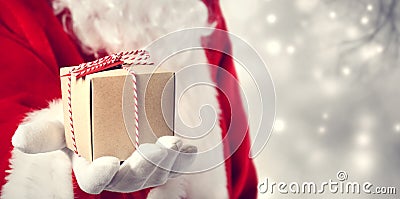 Santa Claus giving a gift Stock Photo