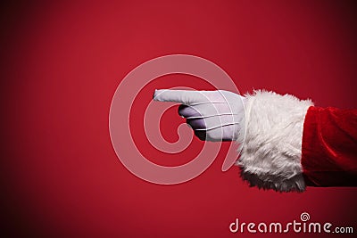 Santa Claus gloved hand pointing finger Stock Photo
