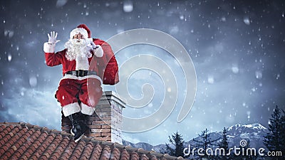 Santa Claus Greeting On Roof Stock Photo