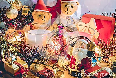 Santa claus hold bell and christmas candle, couple teddy bears and Ornament decorate Merry Christmas , happy new year Stock Photo