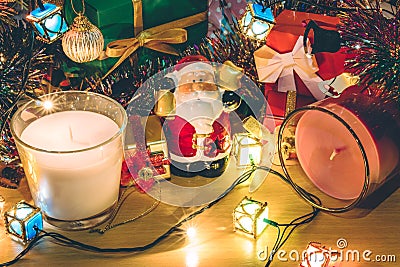 Santa claus hold bell, white and violet christmas candle, Ornament decorate Merry Christmas and happy new year Stock Photo