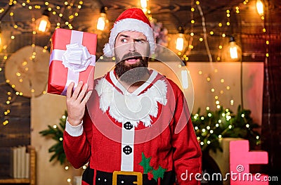 Santa claus hold gift box. May your home be filled with all joys of season. New year celebration. Man bearded santa Stock Photo