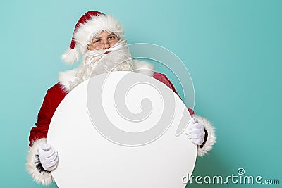 Santa Claus holding blank cardboard circle Stock Photo