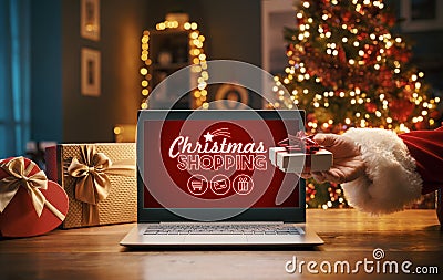 Santa Claus holding a gift and Christmas shopping Stock Photo