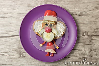 Funny sandwich Santa on plate and board Stock Photo