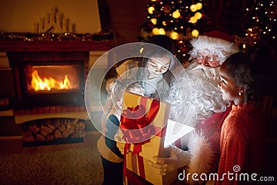 Santa Claus with magic present Stock Photo