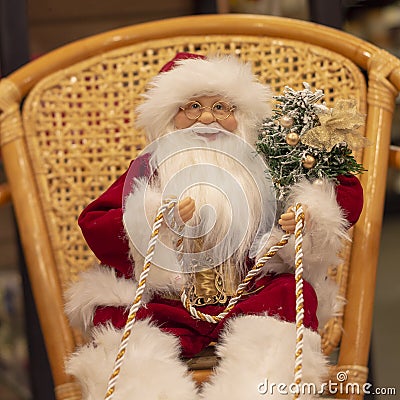Santa Claus in New Year holds reins of sled, toy. Stock Photo