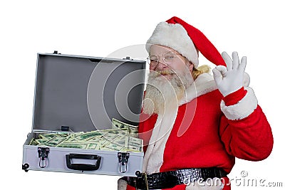 Santa Claus with open case full of money. Stock Photo