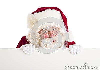 Santa Claus Peeking Through Blank Billboard Stock Photo