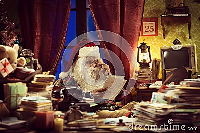 Santa Claus reading a letter Stock Photo