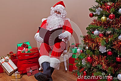 Santa Claus reading the list Stock Photo