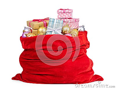 Santa Claus red bag full of Christmas boxes with gifts and toys, isolated on white background. File contains a path to isolation Stock Photo