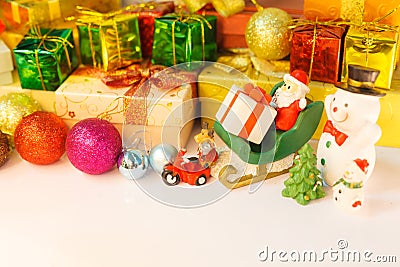 Santa Claus, reindeer and snowman get off to deliver good kids gifts, background with decorated Christmas present boxes, tree and Stock Photo