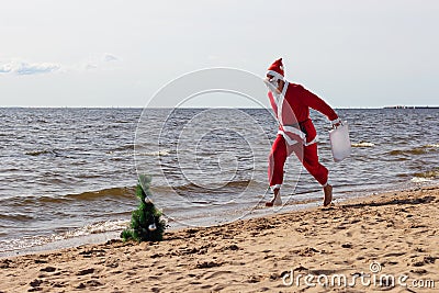 Santa claus is running with gifts delivery vacation christmas new year Stock Photo