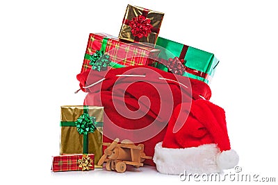 Santa Claus sack full of gift wrapped presents Stock Photo