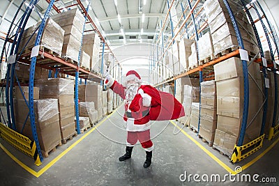 Santa Claus + sack , ringing in a bell Stock Photo