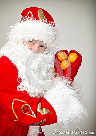 Santa Claus shows heart. Stock Photo