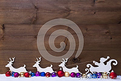 Santa Claus Sled With Reindeer, Snow, Colorful Christmas Balls Stock Photo