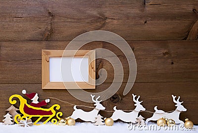 Santa Claus Sled, Reindeer, Snow, Copy Space, Golden Ball, Frame Stock Photo