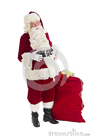 Santa Claus Standing With Bag Full Of Gifts Stock Photo