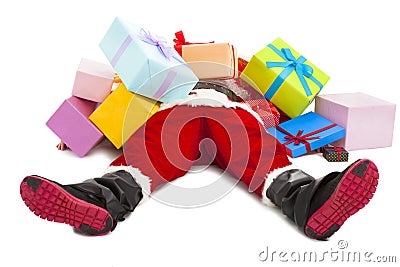 Santa claus too tired to lie on floor with many gift boxes Stock Photo