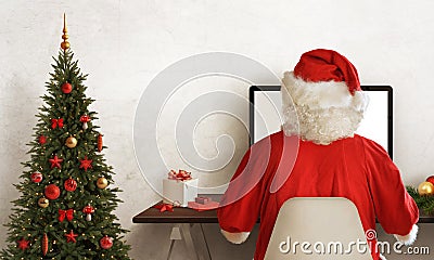 Santa Claus work hard during Christmas. Christmas tree and gift beside Stock Photo