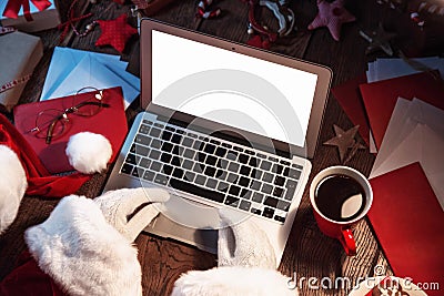 Santa Claus working on computer Editorial Stock Photo