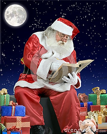 Santa Claus writing his notebook on the roof of a Stock Photo