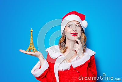 Santa Clous girl with Eiffel tower gift Stock Photo