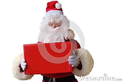 Santa holds a big red box, gifts, sales, shows the postage, the concept of the international holiday delivery of goods, christmas Stock Photo