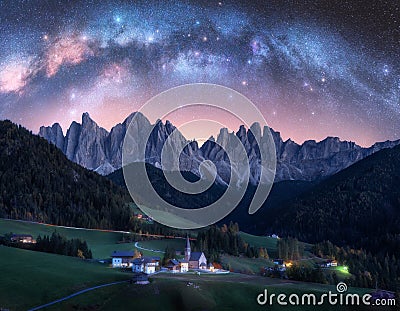 Santa Maddalena and acrhed Milky Way at night in summer in Italy Stock Photo