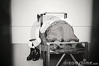 Santa Rests Inside the Jail Cell Stock Photo