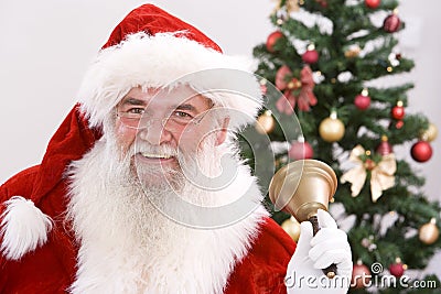 Santa ringing his bell Stock Photo