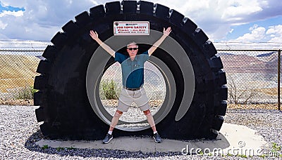 Traveler poses at landmark roadside attraction Editorial Stock Photo