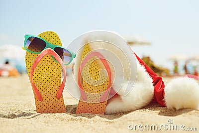Santa`s hat on the beachon Christmas Day. Stock Photo
