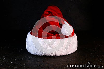 Christmas minimal concept with Santa`s red hat . Stock Photo